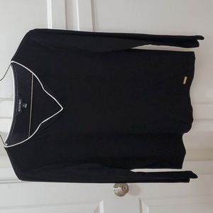 Long sleeve black tee with white trim on neckline
